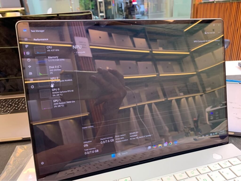 Windows Task Manager Performance tab on AMD Ryzen 9 8940HX laptop showing NPU Compute Accelerator Device at 0% utilization with 7.6 GB total NPU memory, CPU running at 4.57 GHz, NVIDIA GeForce RTX 40 GPU at 49°C, and AMD Radeon 780M integrated GPU at 48°C during idle benchmark test