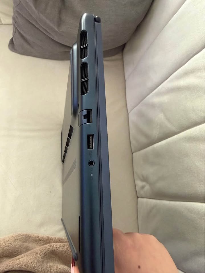 Alienware 16 Aurora Intel Core 7 laptop left side view showing USB-A port, RJ-45 Ethernet port, 3.5mm audio jack, and dual exhaust ventilation grilles for thermal cooling management