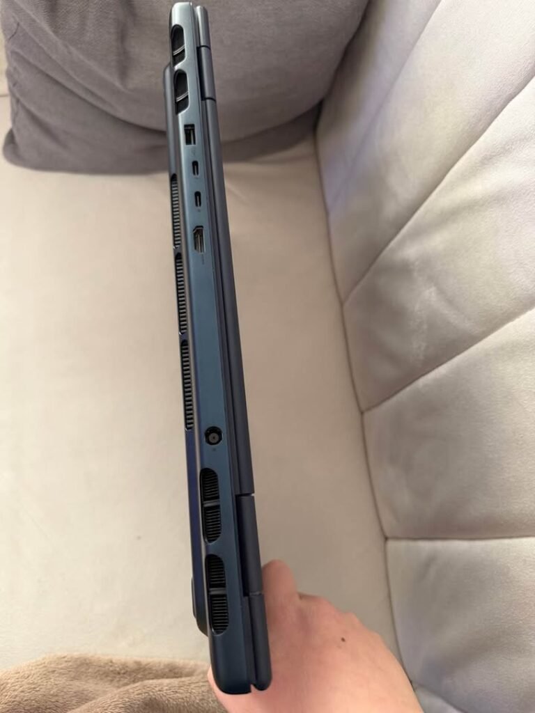 Alienware 16 Aurora Core 7 right side profile view showing USB-A port, dual USB-C Thunderbolt ports, HDMI port, and ventilation grilles on dark blue aluminum chassis