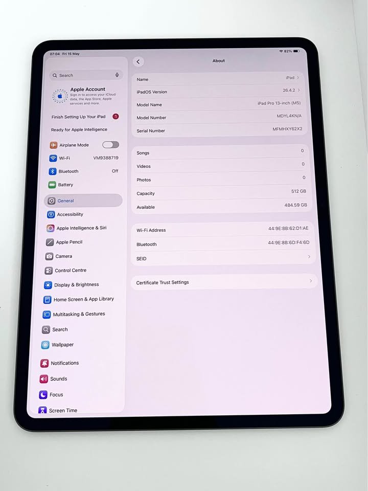 Apple iPad Pro 13-inch M5 About screen in iPadOS Settings showing model name, 512GB storage capacity with 484.59GB available, serial number, Wi-Fi and Bluetooth addresses, and iPadOS version 26.4.2