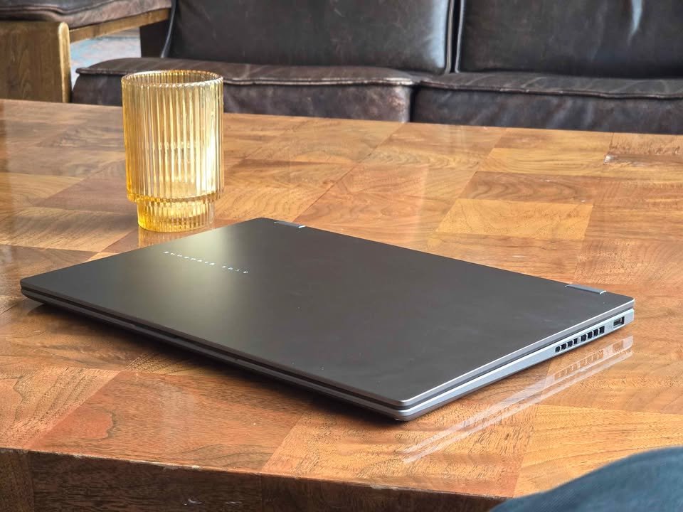 ASUS Vivobook 14 Flip Core Ultra 7 closed rear view showcasing ultra-slim aluminum lid design, right-side ventilation grille, and USB-A port
