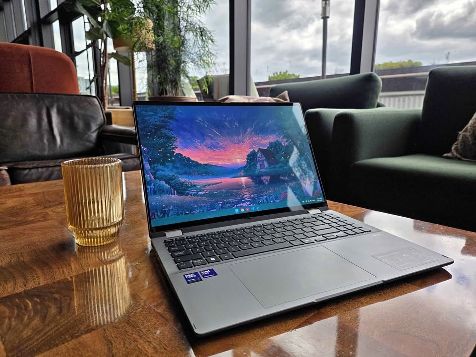 ASUS Vivobook 14 Flip Intel Core Ultra 7 2-in-1 laptop open at 90 degrees angle showcasing full-size chiclet keyboard layout with dedicated numpad and large precision touchpad