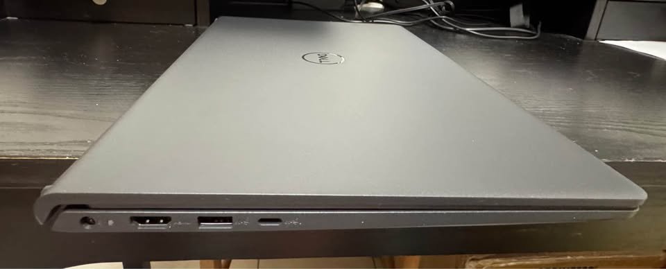 Dell Inspiron 15 Core i7-1355U laptop closed lid right-side view displaying 3.5mm audio jack, HDMI port, USB-A port, and USB-C port