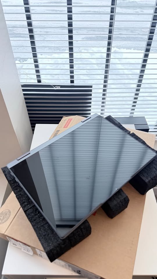 Lenovo IdeaPad 5 2-in-1 Ryzen AI 7 laptop displayed in tent mode showcasing its 360-degree rotating hinge and touchscreen display