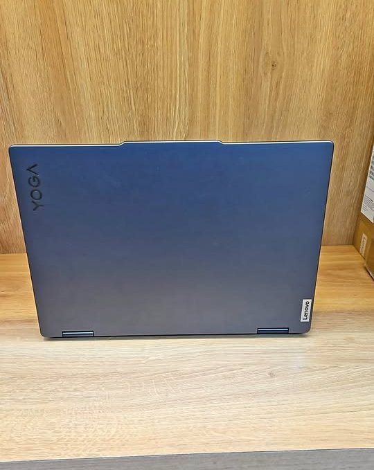 Lenovo Yoga 7 2-in-1 laptop closed lid rear view showcasing premium Abyss Blue aluminum build quality