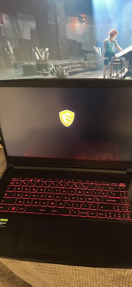 MSI Katana 15 gaming laptop powered by Intel Core i7 processor and NVIDIA RTX GPU, featuring a vibrant RGB backlit keyboard and integrated trackpad