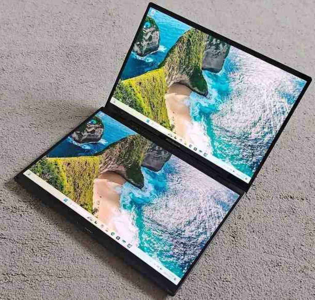 ASUS Zenbook Duo Core Ultra 7 laptop open in dual-screen book mode, featuring two OLED touchscreens, showcasing the full dual-display productivity setup.
